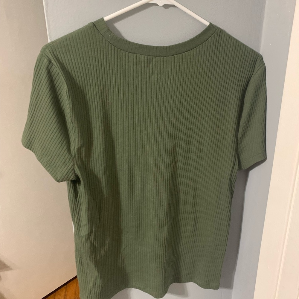 Girls / Juniors dark green shirt.